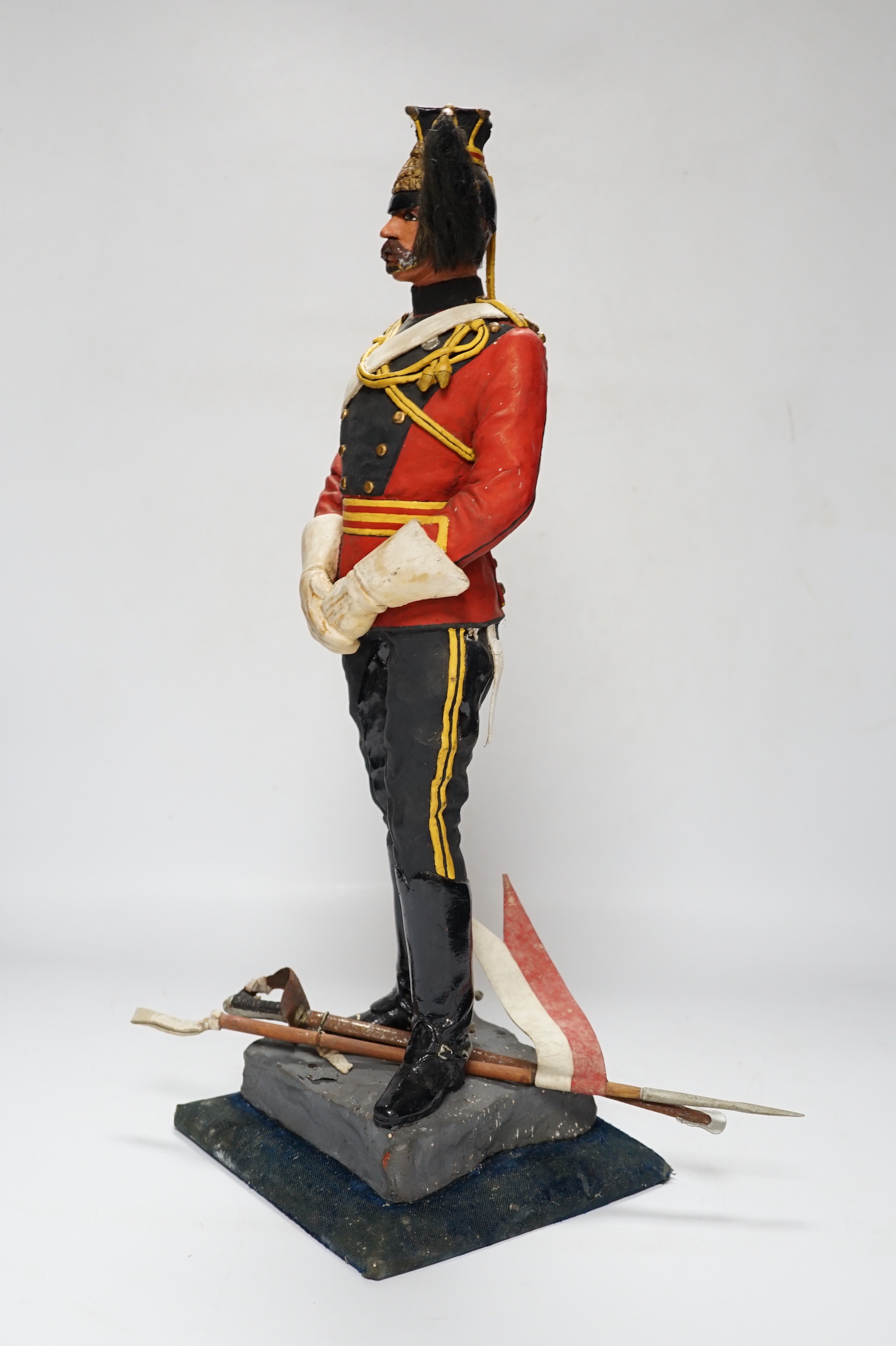 A painted plaster figure of a lancer, 48cm